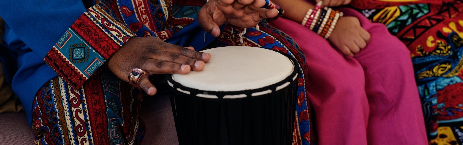 Photo Of Person Playing Djembe
