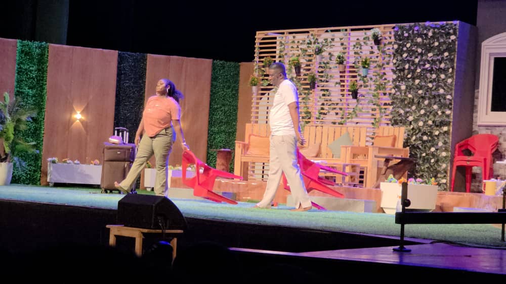 Scene from Ebo Whyte’s “Love on the Ropes” at the National Theatre, featuring emotional drama and live band performance.