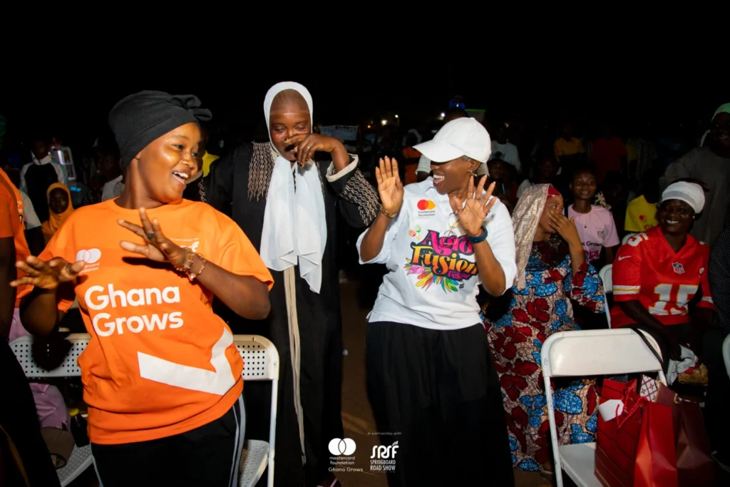 Youth audience and panelists at the Ghana Grows short film premiere in Ashaiman.