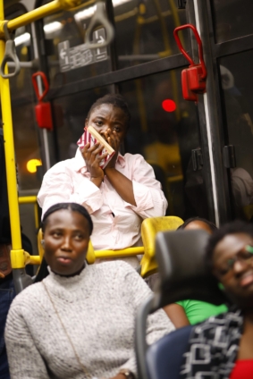 Actors perform an emotional live theatre scene inside an Ayalolo bus during Ghana’s first mobile stage production, Kelewele Junction, by Agape Arts Productions.