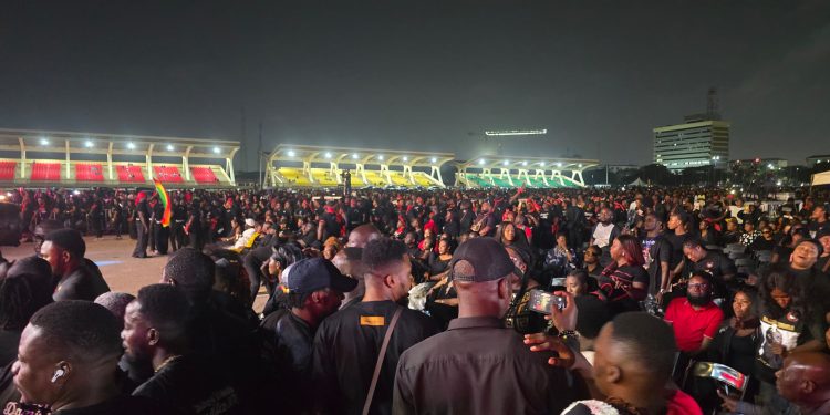 Crowd holding candles during a night vigil at Independence Square in honour of Daddy Lumba