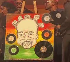 Sharon Dede Padiki showcasing her caricature painting of the late Daddy Lumba during his candlelight vigil at Independence Square.